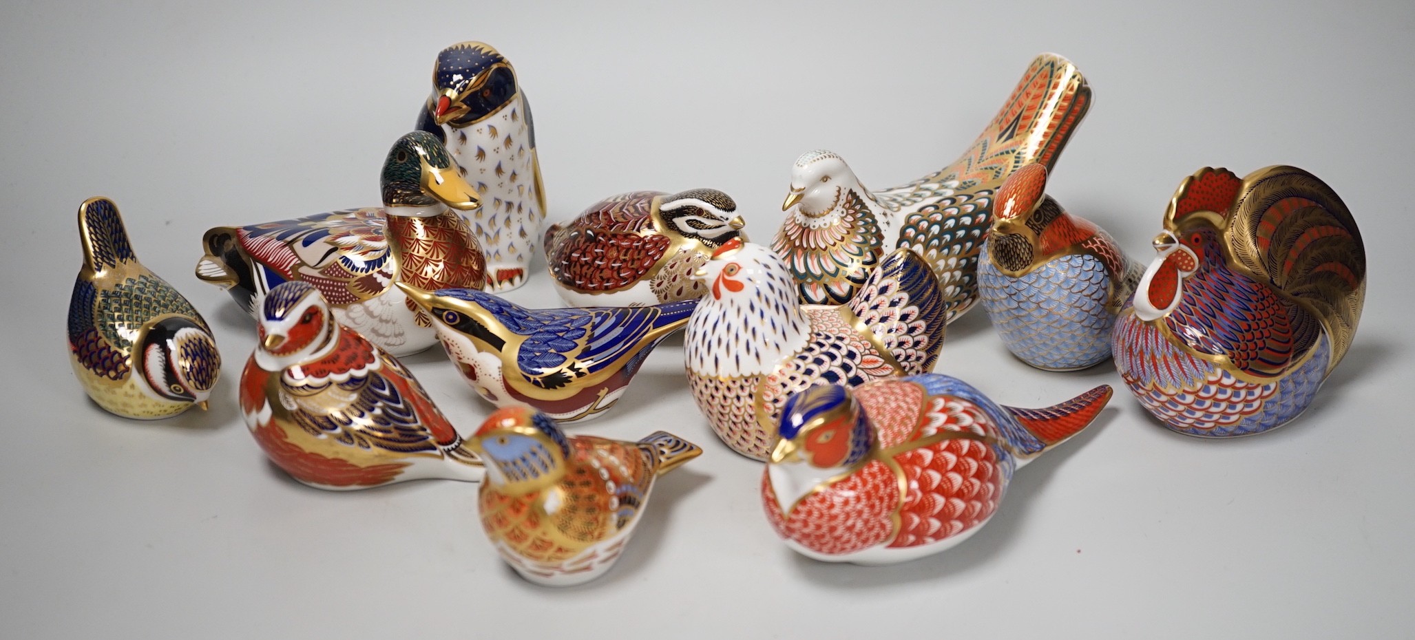 Twelve Royal Crown Derby ‘bird’ paperweights